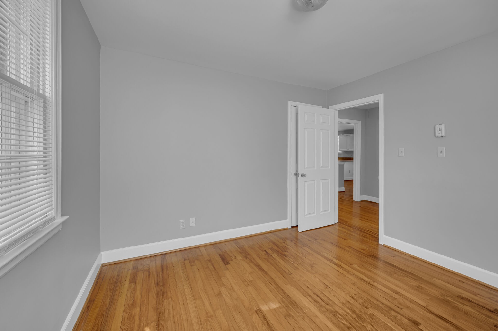1231 Adams Street Franklin, TN 37064 - Photo 19 of 27 a view of an empty room with wooden floor and a window