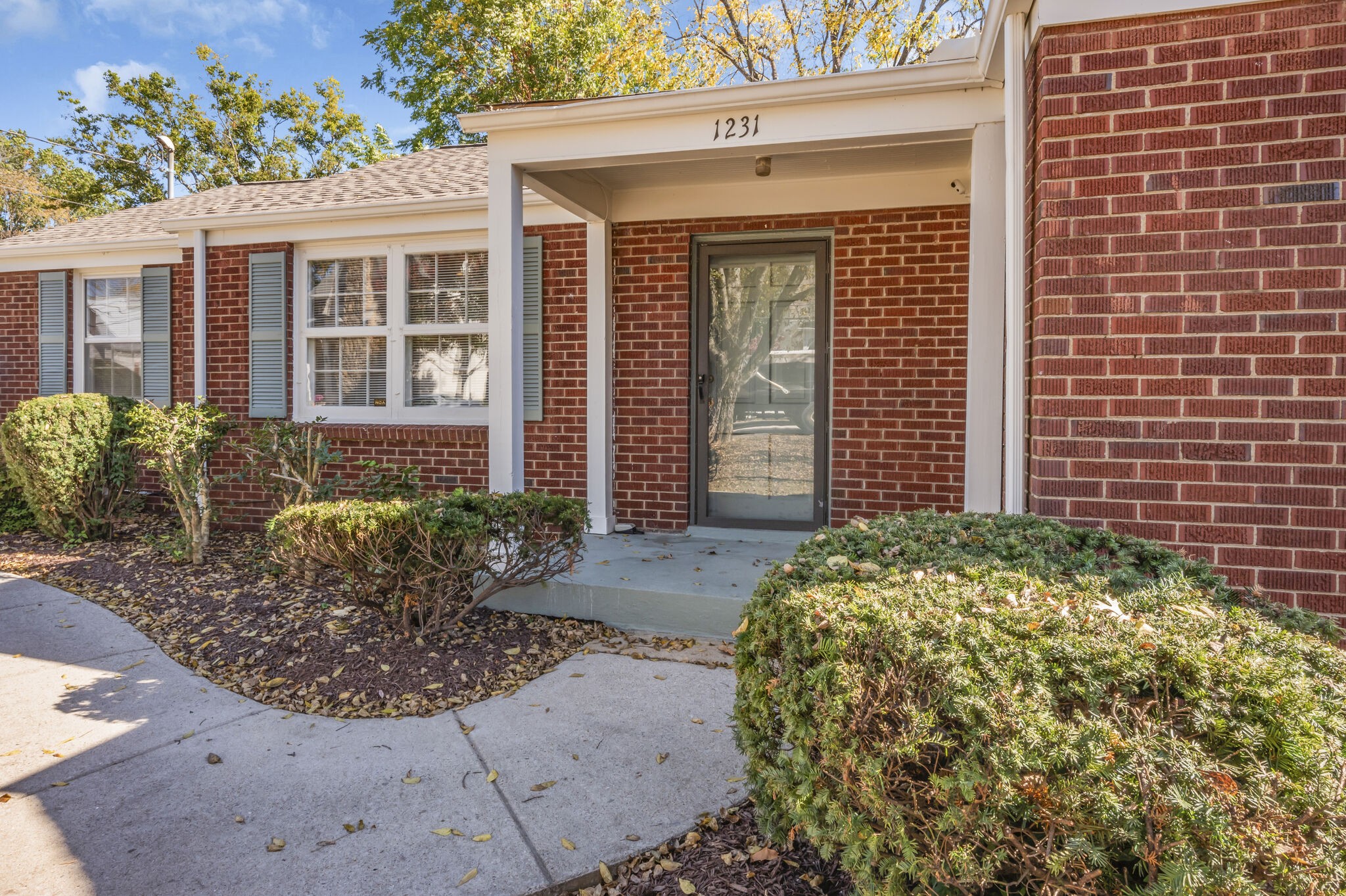 1231 Adams Street Franklin, TN 37064 - Photo 2 of 27 a front view of a house with garden