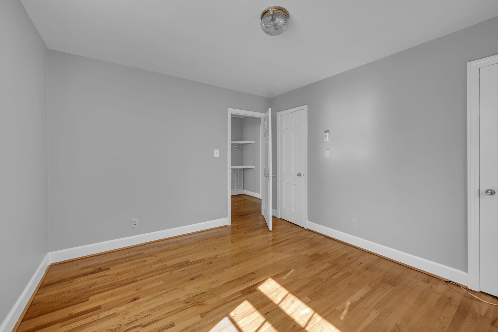 1231 Adams Street Franklin, TN 37064 - Photo 21 of 27 a view of a room with wooden floor and bench