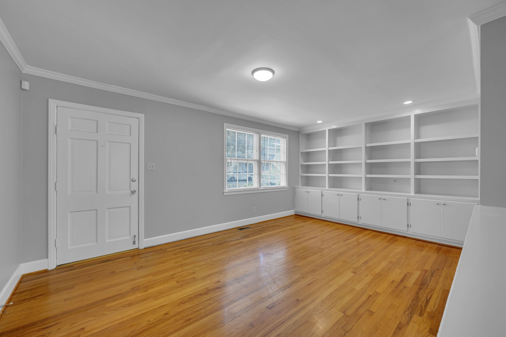 1231 Adams Street Franklin, TN 37064 - Photo 5 of 27 a view of an empty room with a window and wooden floor