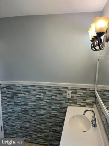 a bathroom with a sink and a window