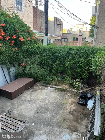 a view of a backyard with sitting area