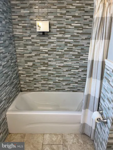 a bathroom with a bathtub