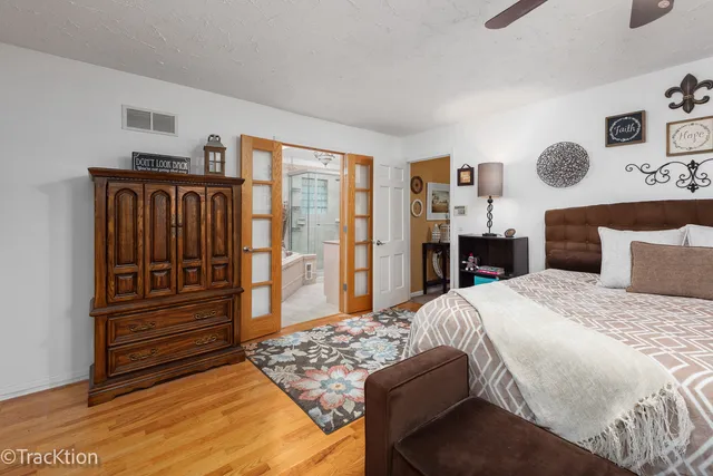 a bedroom with a bed and dresser