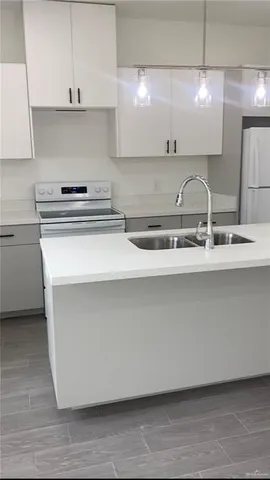 a close view of sink and cabinets