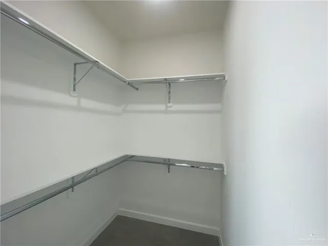a view of an empty walk in closet