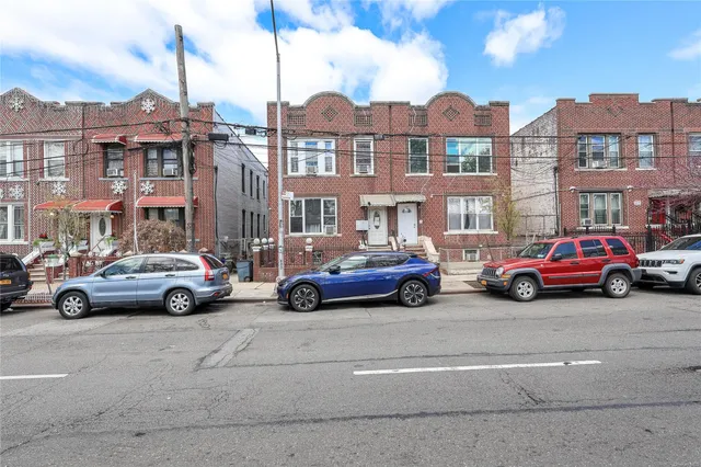 a view of cars parked in front of a building