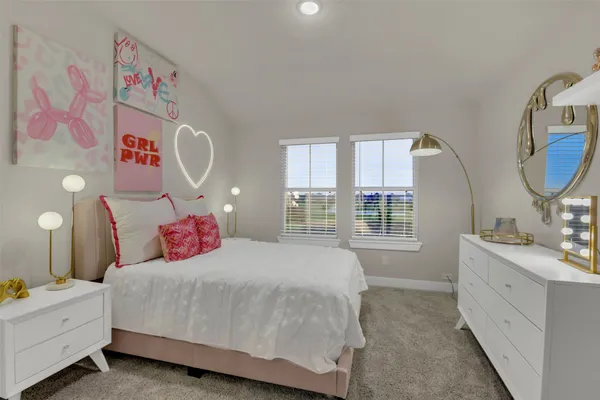 a bedroom with a bed and a mirror