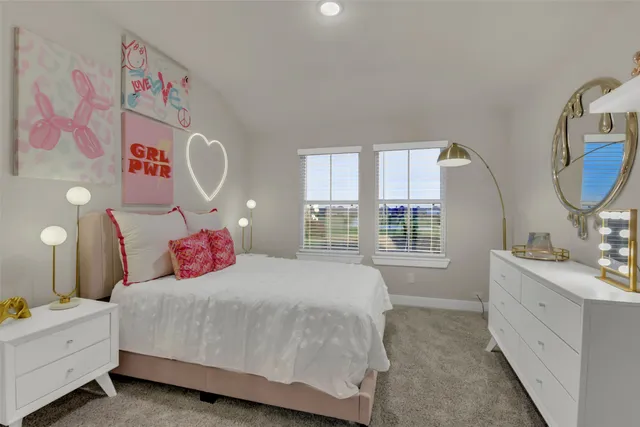 a bedroom with a bed and a mirror