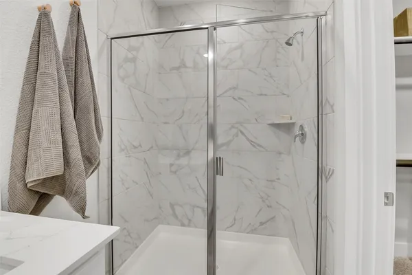 a bathroom with a shower and a tub