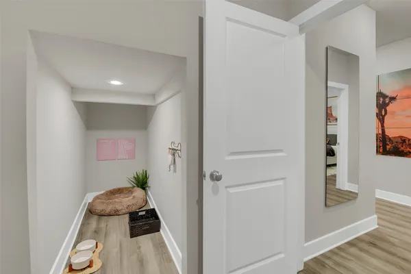 a room with furniture and wooden floor