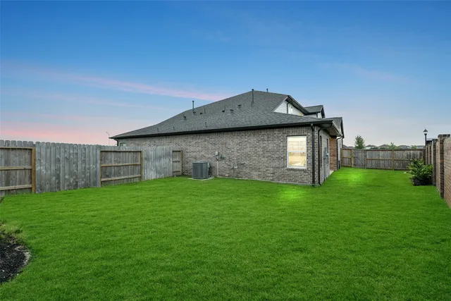 a backyard of a house with lots of green space