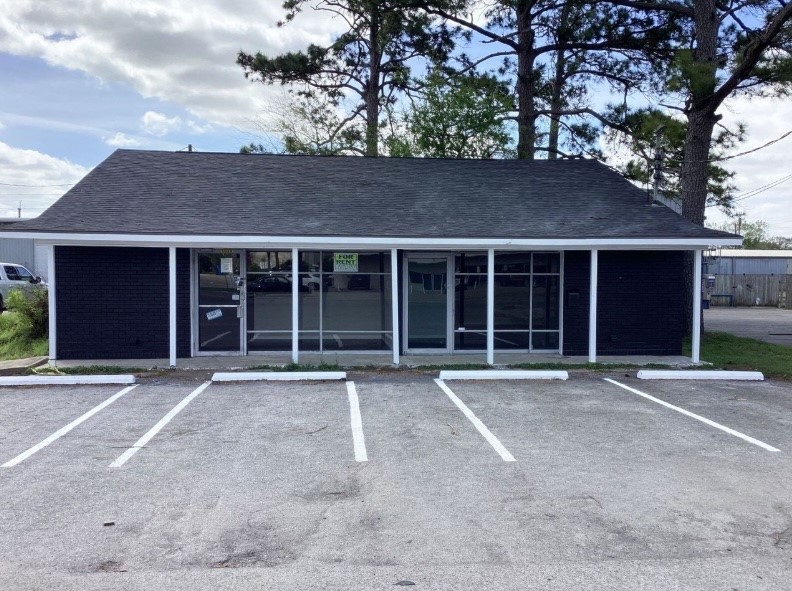 1010 1st Street East Humble, TX 77338 - Photo 2 of 49 a front view of a house with a yard and garage