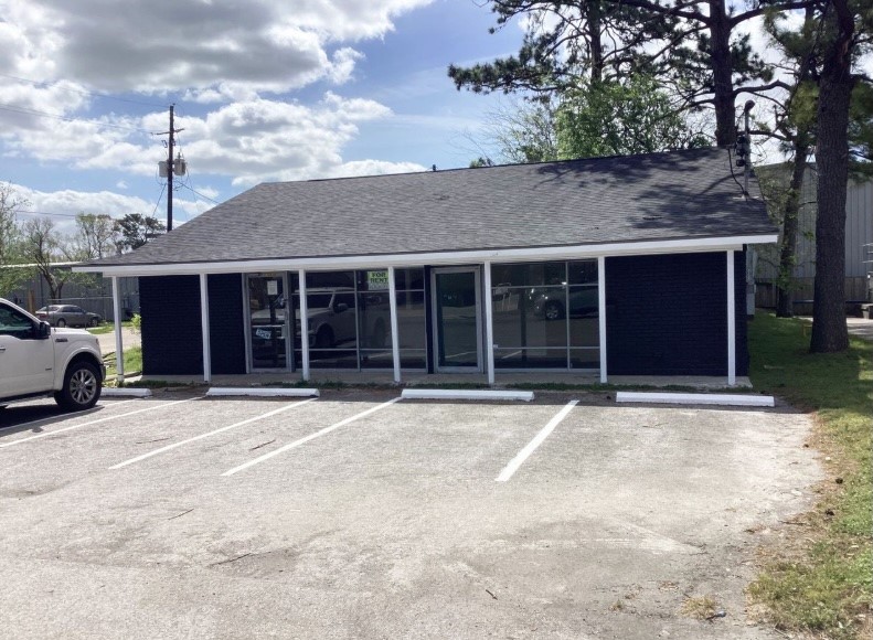 1010 1st Street East Humble, TX 77338 - Photo 21 of 49 a house with trees in the background