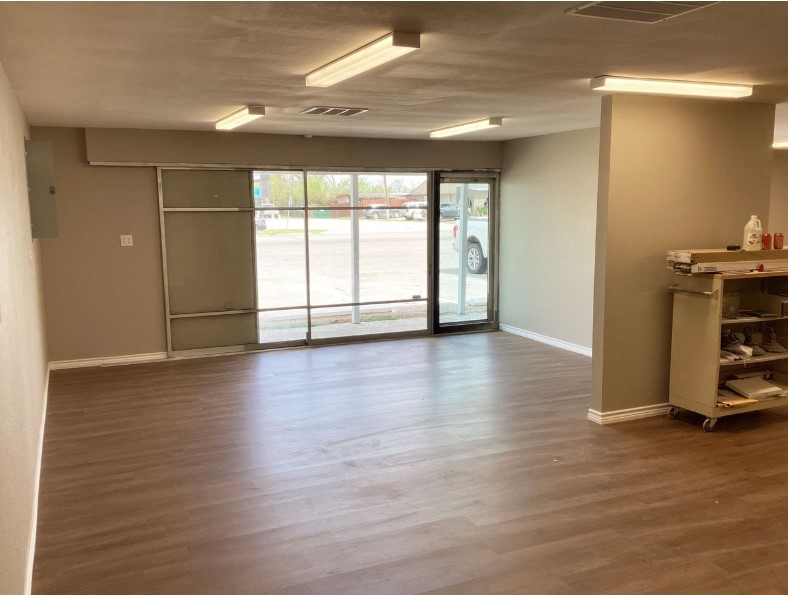 1010 1st Street East Humble, TX 77338 - Photo 34 of 49 a view of empty room with wooden floor and fan