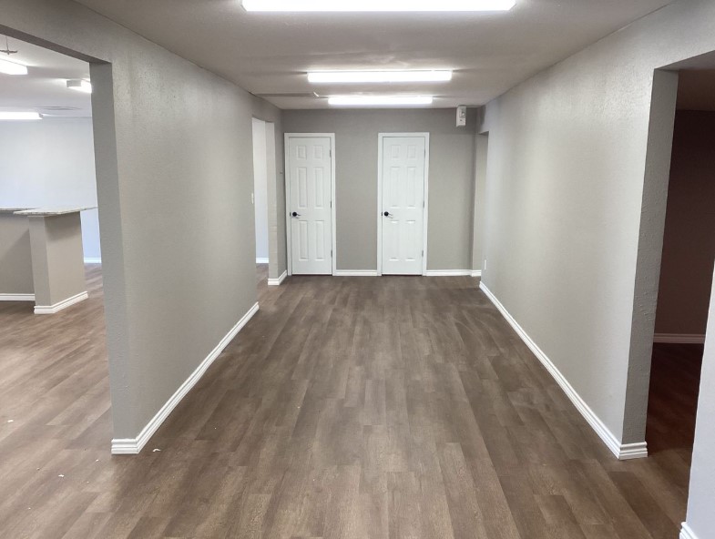 1010 1st Street East Humble, TX 77338 - Photo 46 of 49 a view of a hallway with wooden floor