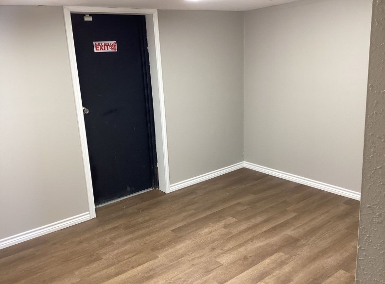 1010 1st Street East Humble, TX 77338 - Photo 49 of 49 a view of an empty room with wooden floor