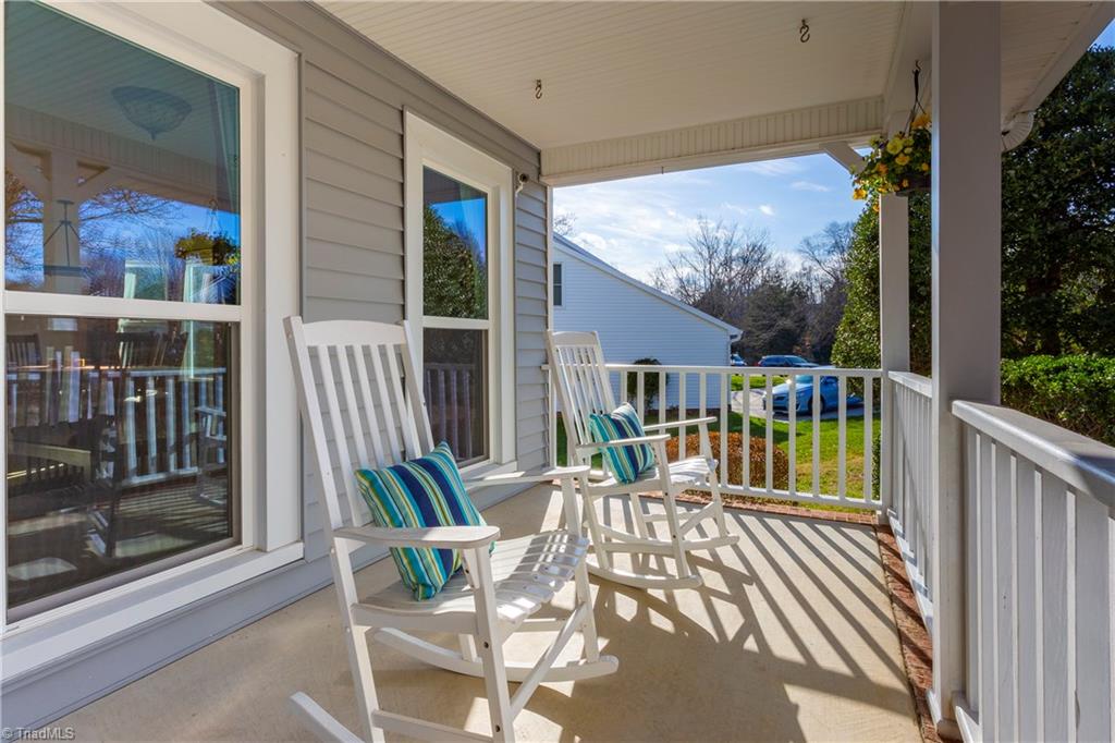 2833 Pickering Road Greensboro, NC 27407 - Photo 3 of 27 Inviting rocking chair front porch