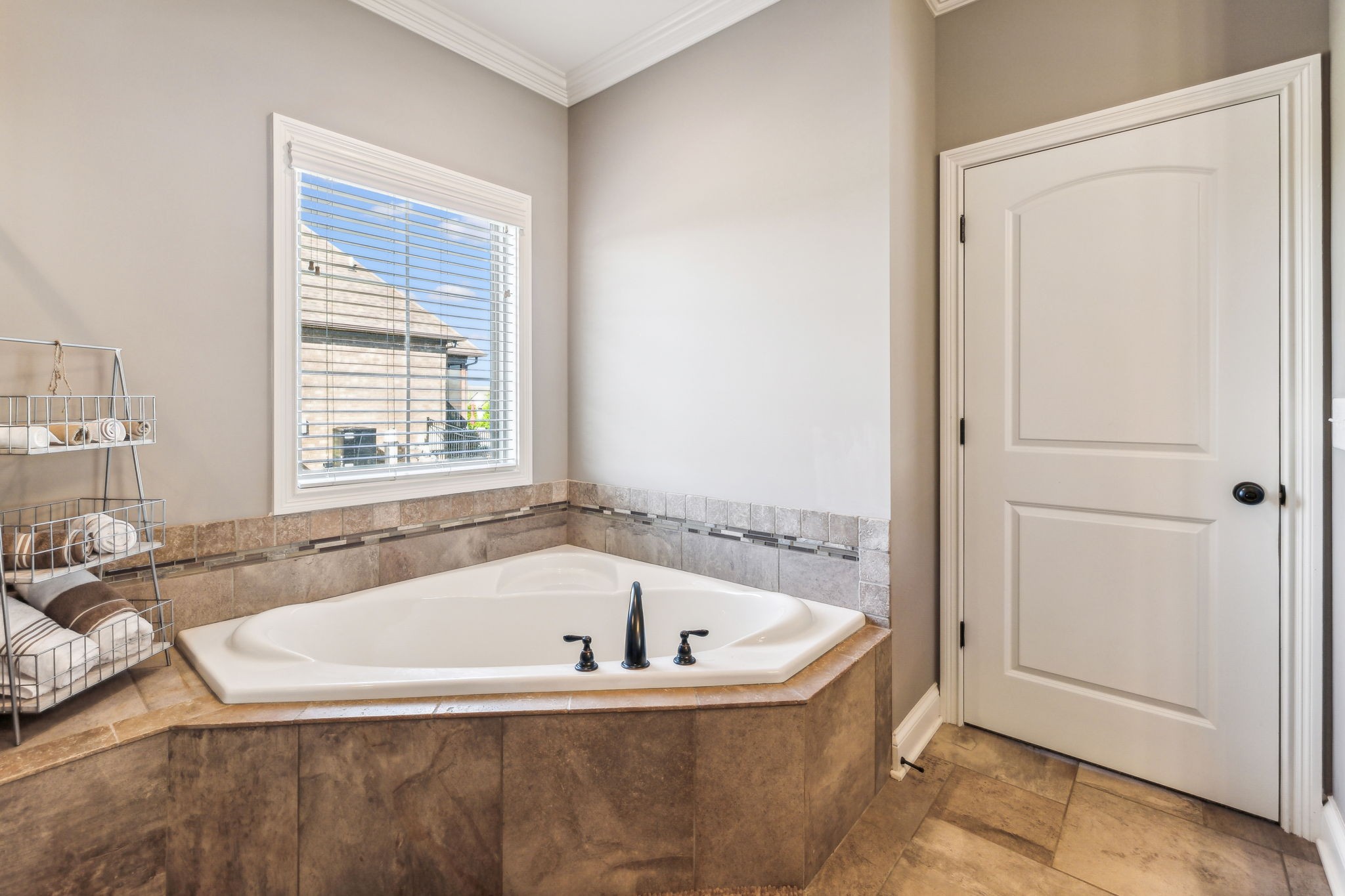 118 Brixton Ridge Lebanon, TN 37087 - Photo 16 of 43 Elegant granite countertops adorn the double vanity, while a separate whirlpool tub offers a serene spot for relaxation. 118 Brixton Ridge Lebanon, TN 37087