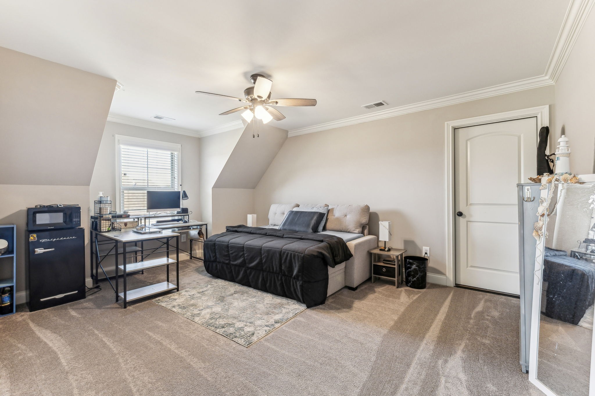 118 Brixton Ridge Lebanon, TN 37087 - Photo 19 of 43 This large second bedroom features elegant crown molding and a ceiling fan, adding a touch of sophistication to the space. 118 Brixton Ridge Lebanon, TN 37087