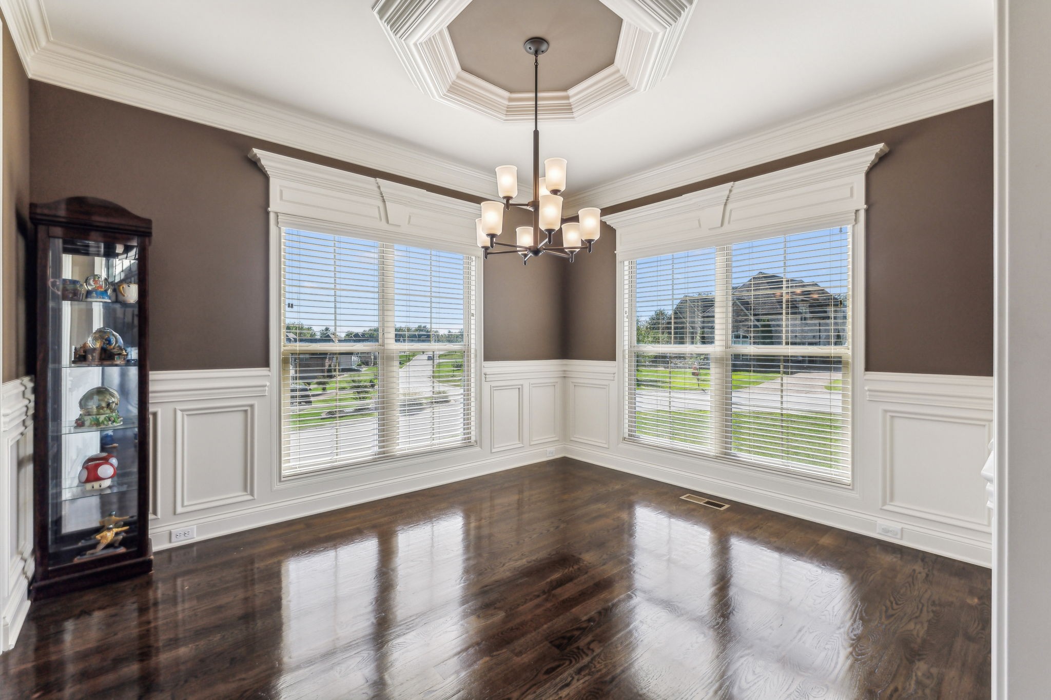 118 Brixton Ridge Lebanon, TN 37087 - Photo 2 of 43 The formal dining room exudes elegance with its crown molding, wainscoting, and stylish overhead fixture that enhance its sophisticated ambiance! 118 Brixton Ridge Lebanon, TN 37087