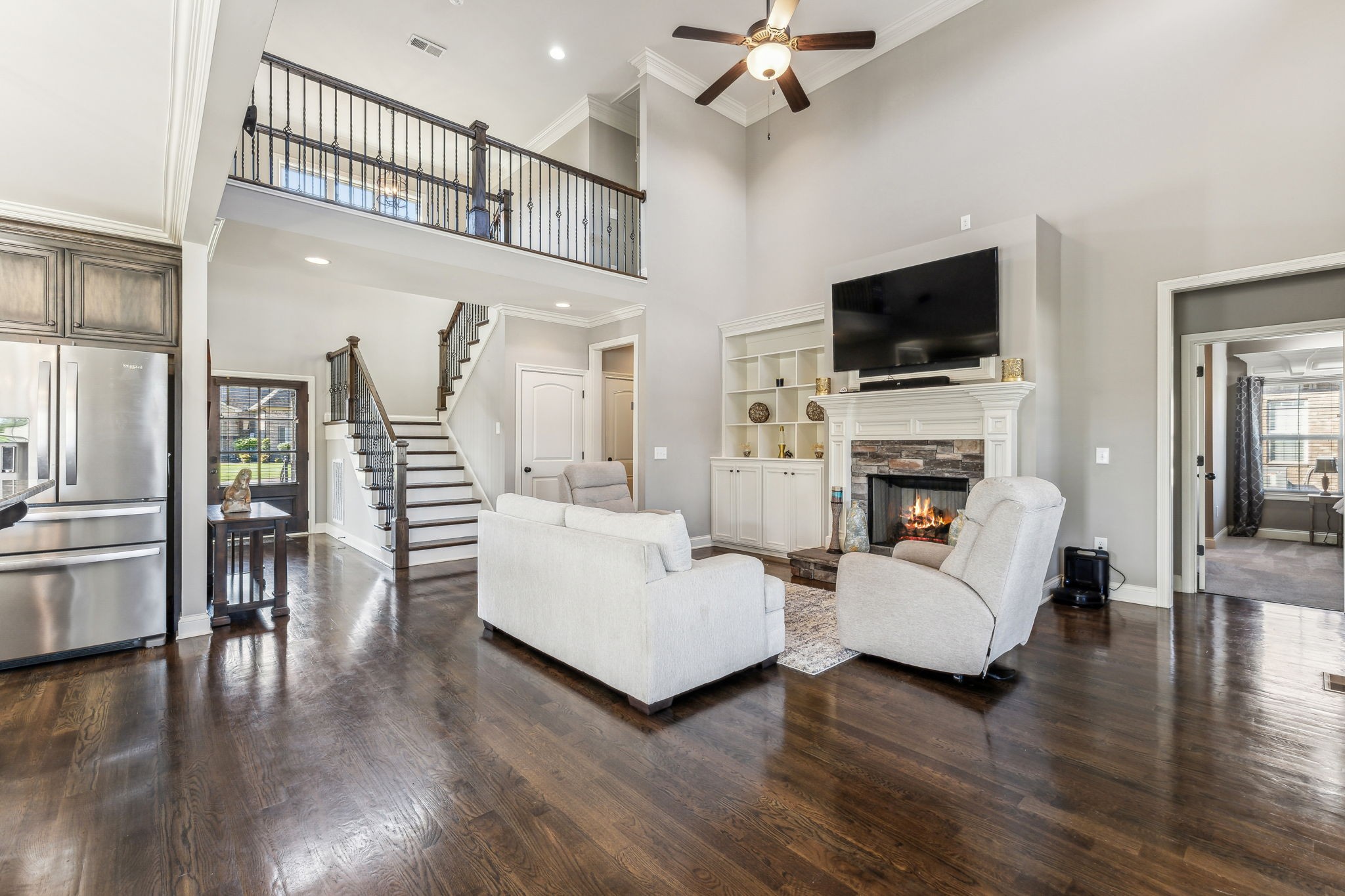 118 Brixton Ridge Lebanon, TN 37087 - Photo 7 of 43 The living room boasts tall ceilings and a stylish catwalk overhead, creating an open and airy atmosphere.118 Brixton Ridge Lebanon, TN 37087