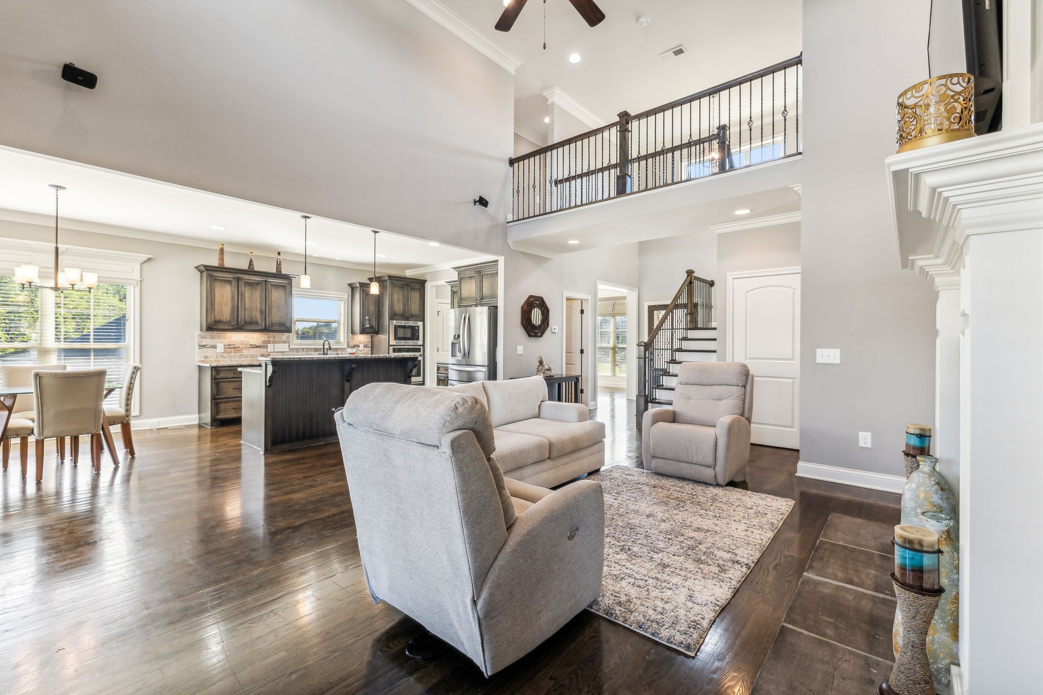 118 Brixton Ridge Lebanon, TN 37087 - Photo 8 of 43 Rich hardwood floors flow seamlessly throughout the space, complemented by a ceiling fan for added comfort. 118 Brixton Ridge Lebanon, TN 37087