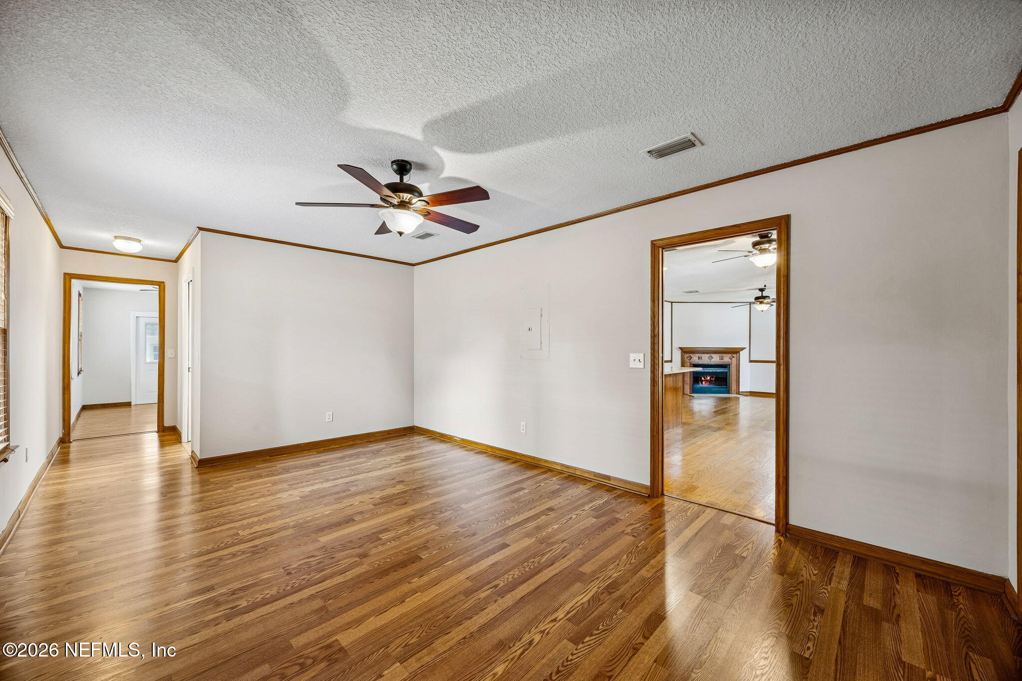 1888 Clemson Road Jacksonville, FL 32217 - Photo 24 of 41 wooden floor in an empty room with a window