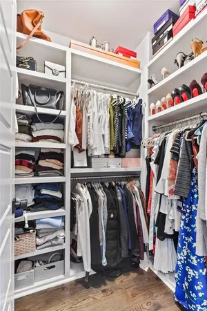 a bathroom with a double vanity sink shower and a mirror