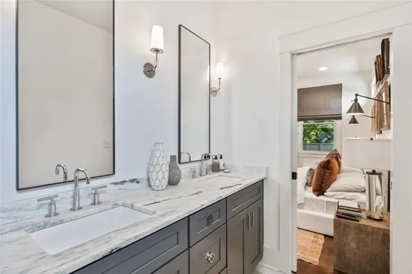 a view of a patio with couches table and chairs and potted plants
