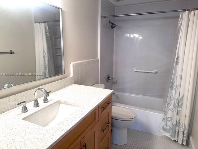 1700 Northeast 105th Street, Unit 505 Miami Shores, FL 33138 - Photo 11 of 20 a bathroom with a granite countertop sink toilet and shower