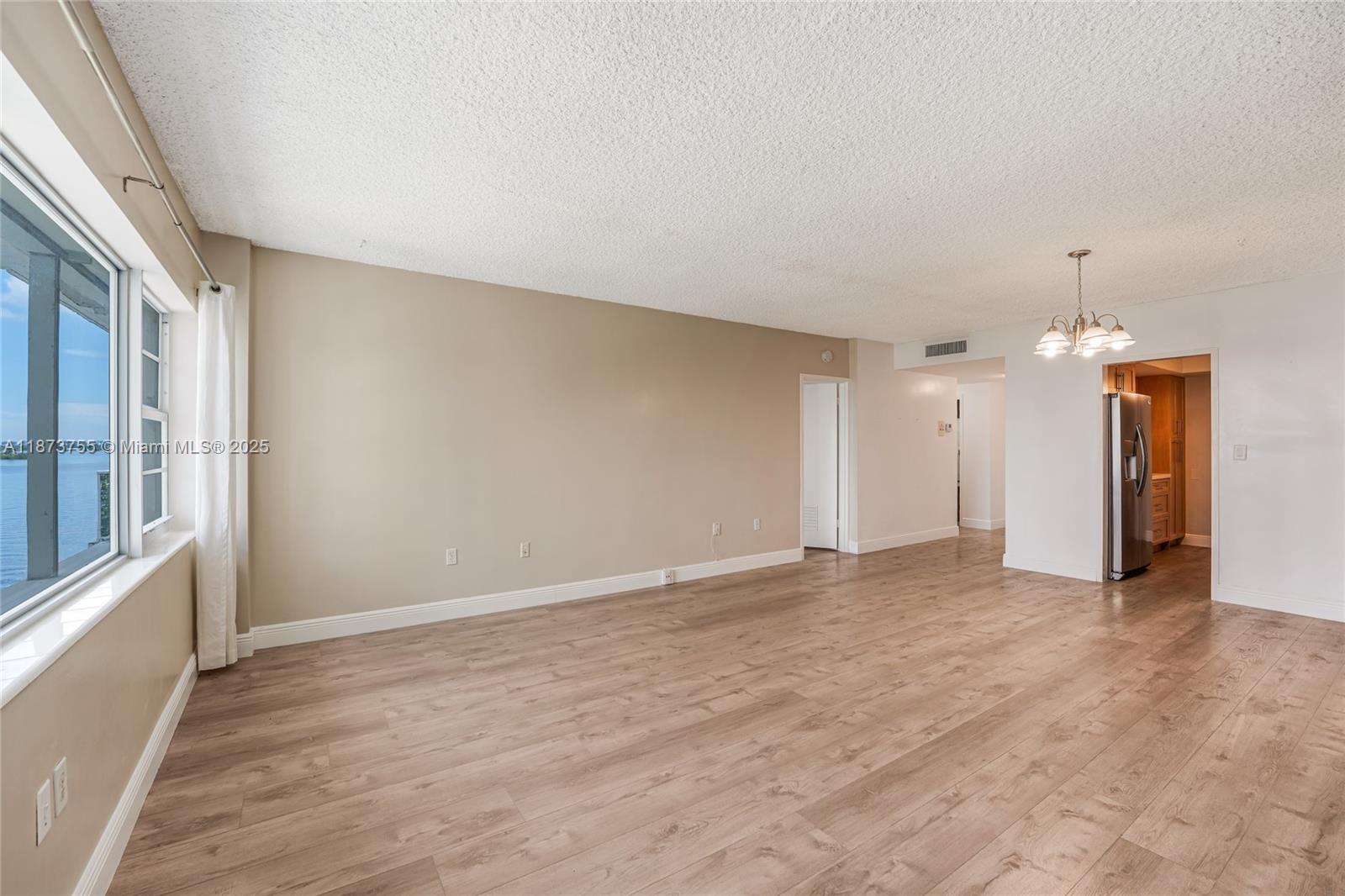 1700 Northeast 105th Street, Unit 505 Miami Shores, FL 33138 - Photo 14 of 20 a view of an empty room with a window