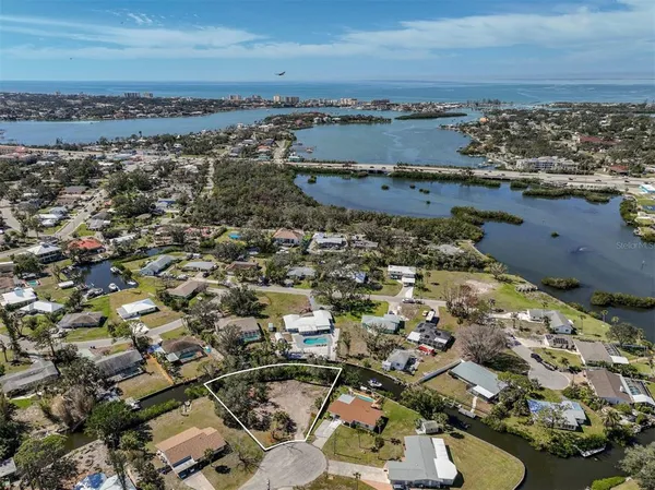 an aerial view of a residential building with outdoor space