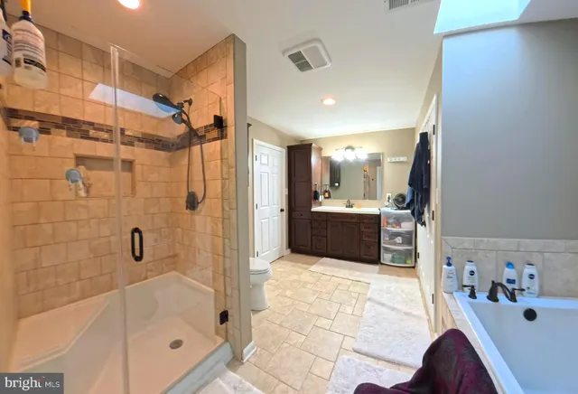 a bedroom with a bed and cabinets