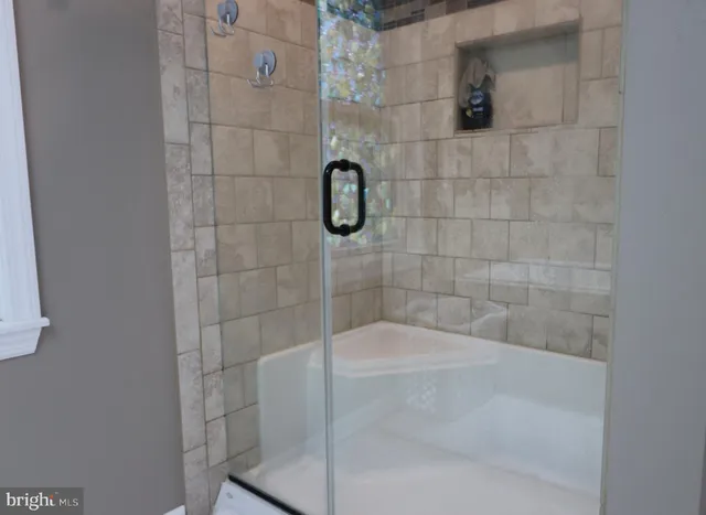 a view of a small space with wooden floor