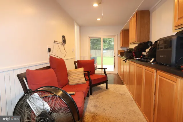 a front view of a house with a garden and yard