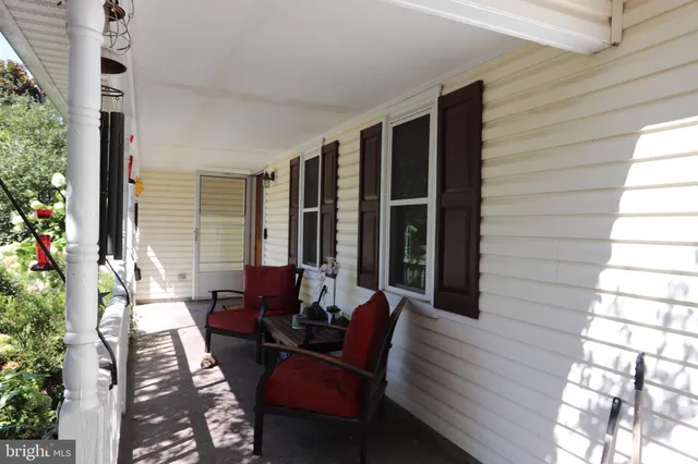 a kitchen with a sink a stove a window and cabinets