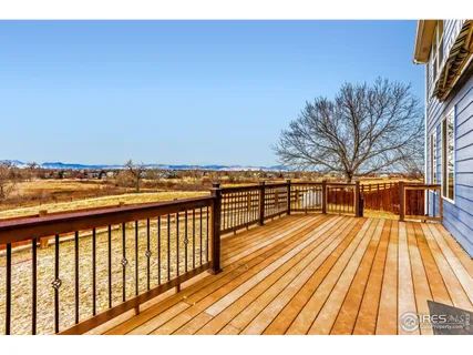 a view of balcony with wooden floor and outdoor space