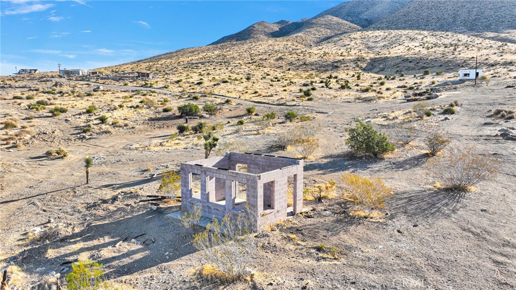 20828 Riverview Road Apple Valley, CA 92308 - Photo 6 of 11 a view of a road with a building in the background