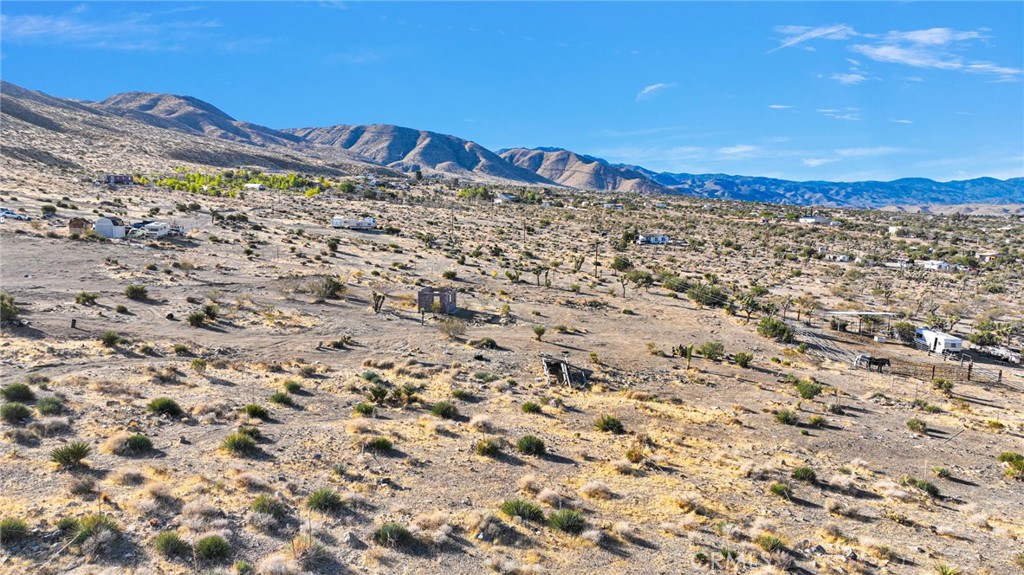 20828 Riverview Road Apple Valley, CA 92308 - Photo 8 of 11 a view of a large building with a field