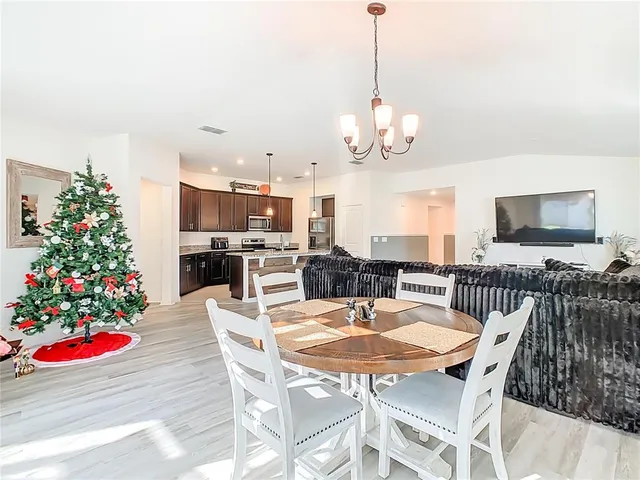 a bedroom with a bed lamp and a window