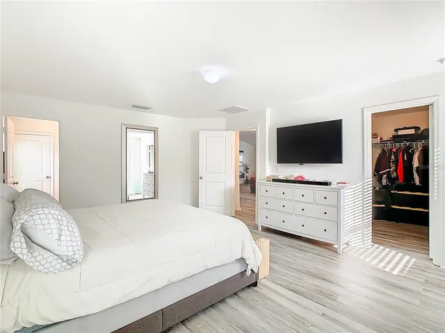 a view of a house with backyard and porch