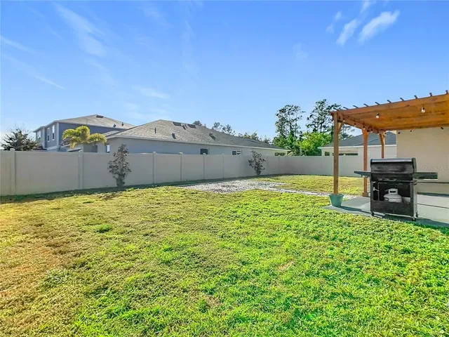 a view of a swimming pool and an outdoor seating