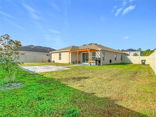 an aerial view of a house with a swimming pool