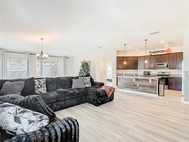 a bedroom with a large bed and a flat screen tv