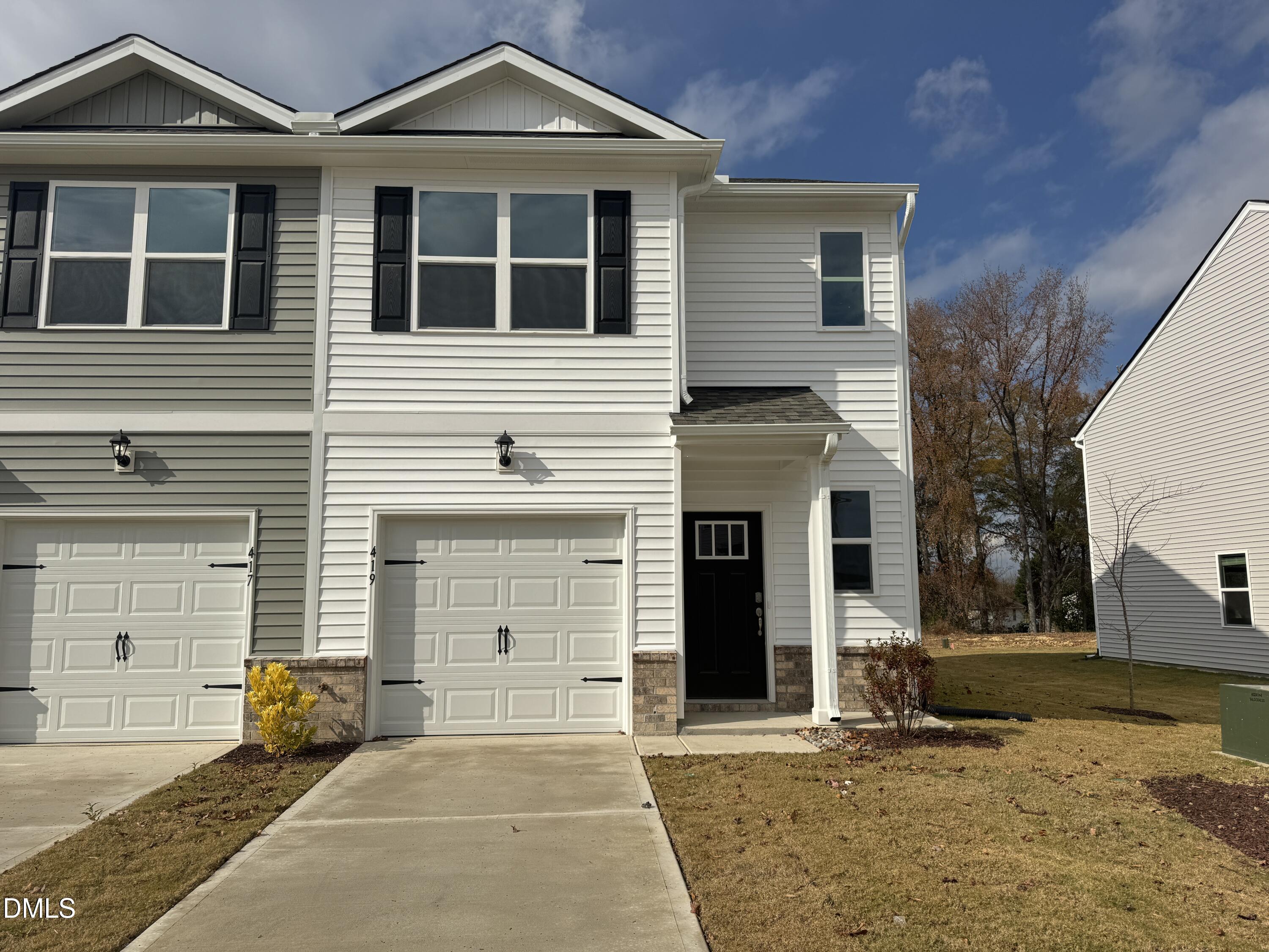 a front view of a house with yard