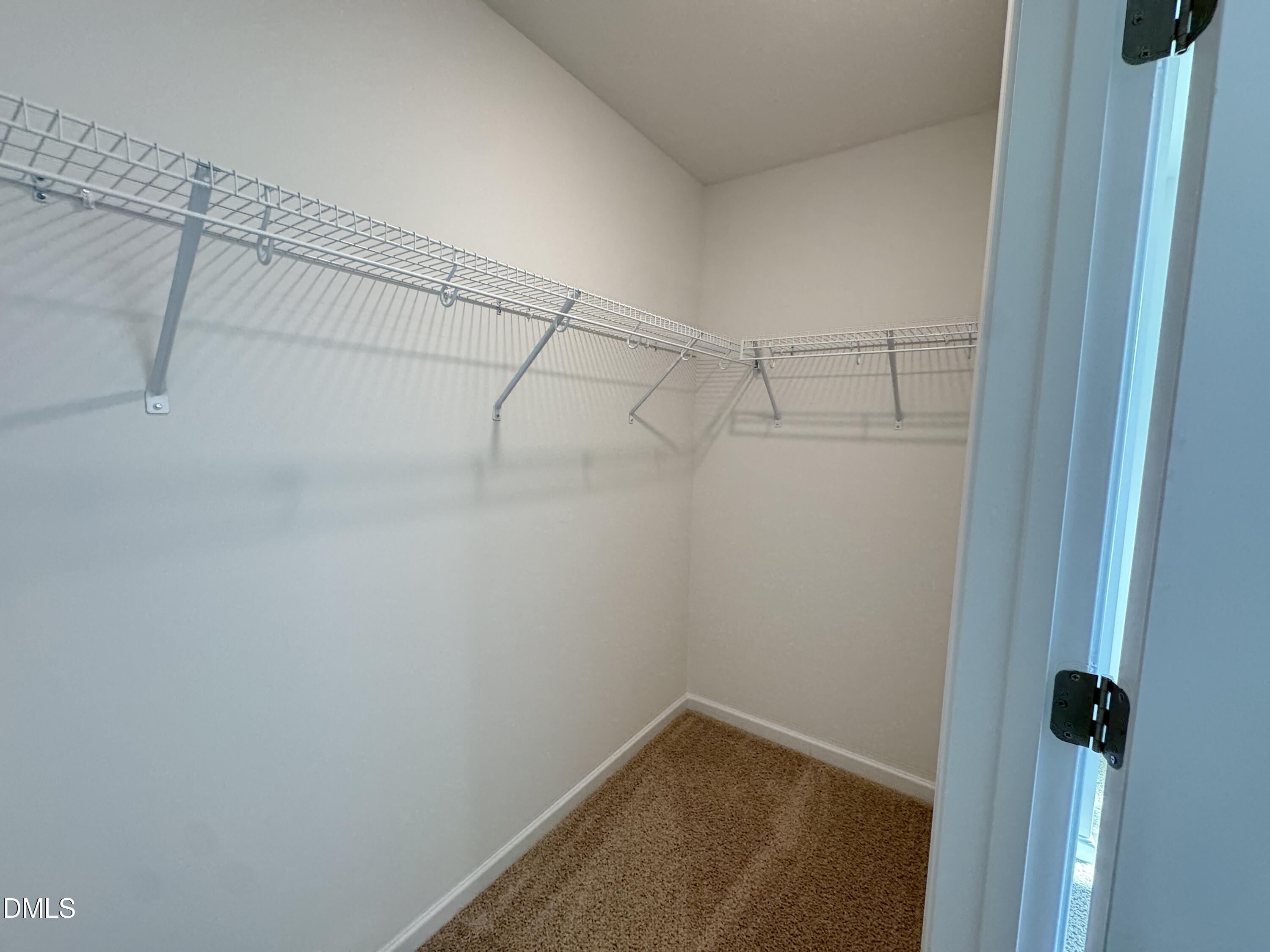 419 Belgian Red Way Wake Forest, NC 27587 - Photo 12 of 18 a view of a room with racks on the wall