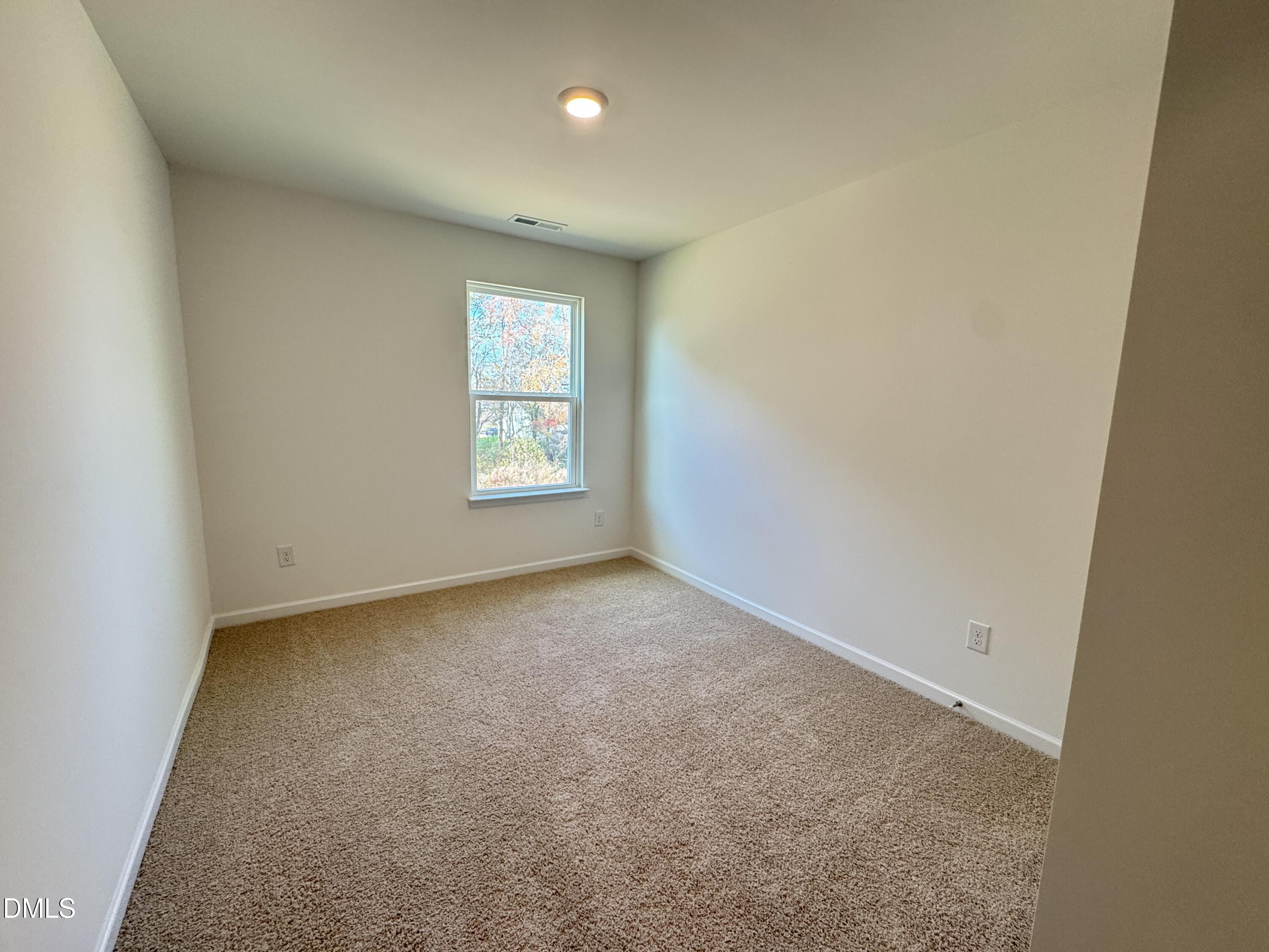 419 Belgian Red Way Wake Forest, NC 27587 - Photo 14 of 18 an empty room with a window