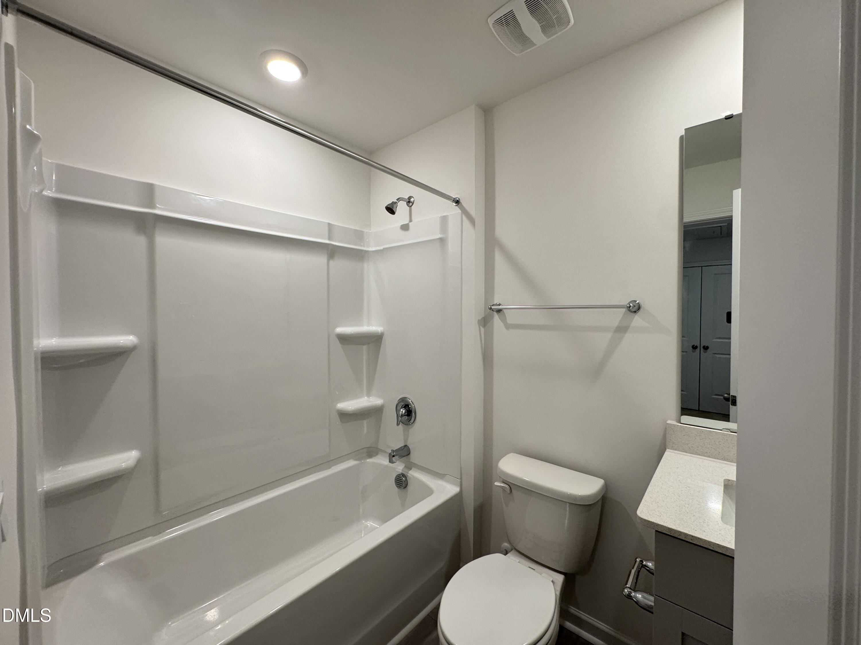 419 Belgian Red Way Wake Forest, NC 27587 - Photo 16 of 18 a bathroom with a toilet a sink and bathtub