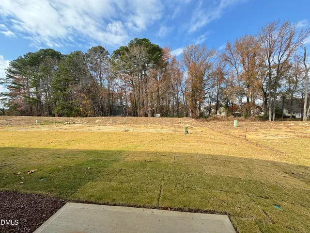 a view of ocean with a building in the background